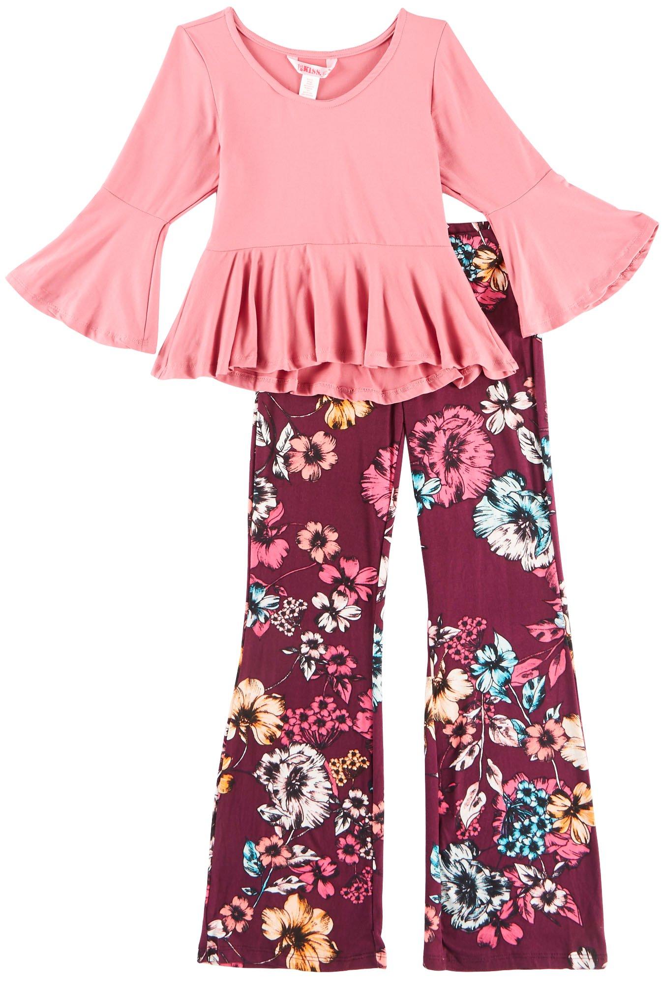 1st Kiss delivers fun and fashionable apparel! Three quarter sleeve peplum top features a solid design, bell sleeves, a round neckline, and ruffled hemline. Set includes a coordinating pair of vibrant floral print pull-on leggings with an elastic waist.